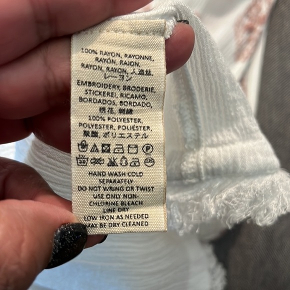 Free People size xs sleeveless flowy blouse.  Embroidery o top and hem.  Keyhole - Picture 5 of 5